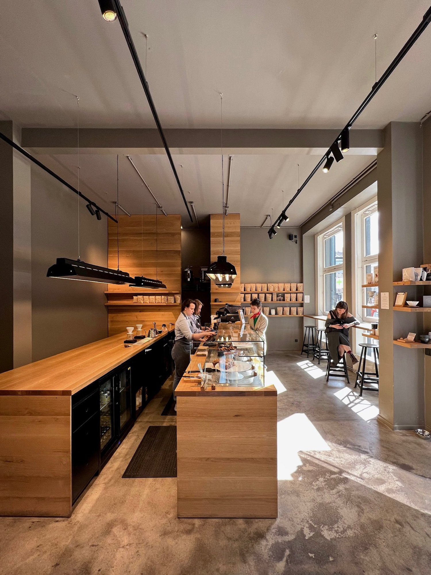 Cafe interior, baristas working