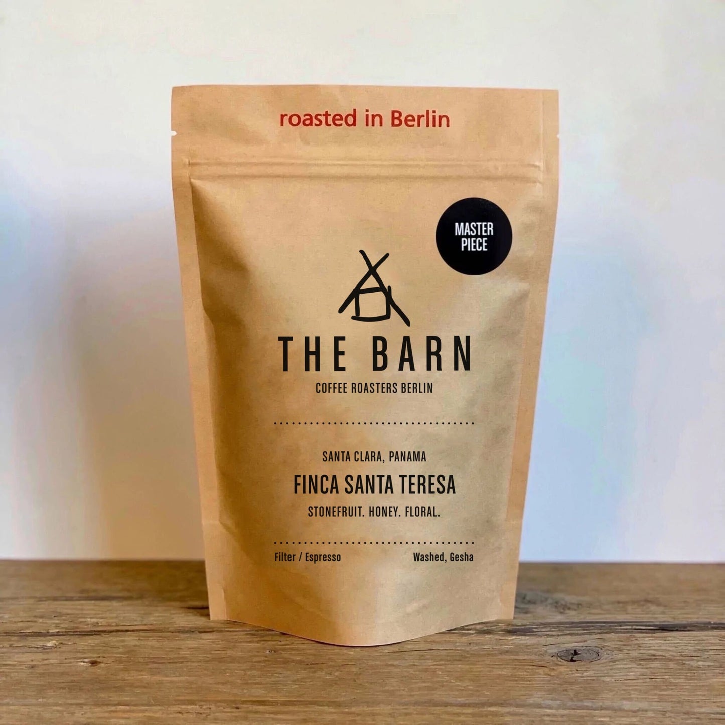 A brown bag of Finca Santa Teresa, freshly roasted filter/espresso coffee beans with a masterpiece sticker